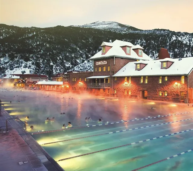 Light up hot springs pool with mountain backdrop at glenwood hot springs colorado