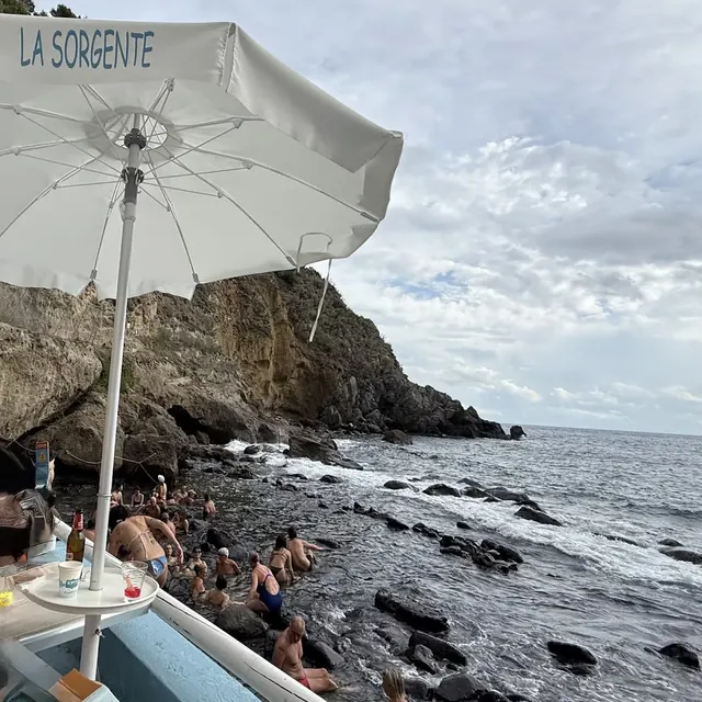 natural thermal rock pools with steam on Ischia southwest coast near Panza on Sorgeto Bay, Italy.