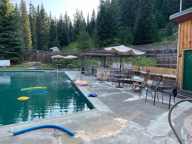 outdoor hot spring pool with forest in the background at red river hot springs idaho