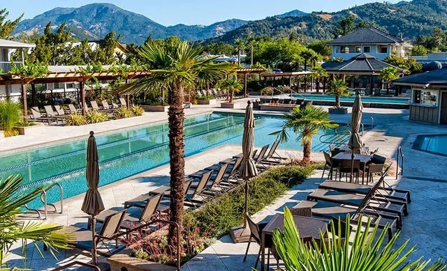 outdoor mineral pools on travertine deck with grape arbors at Calistoga Spa Hot Springs, California