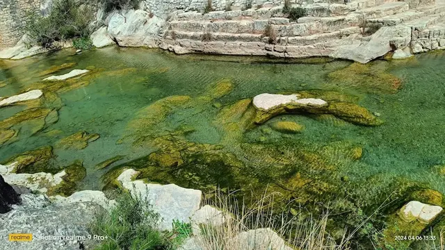 Green clear waters in hot spring river at la fontcalda in spain