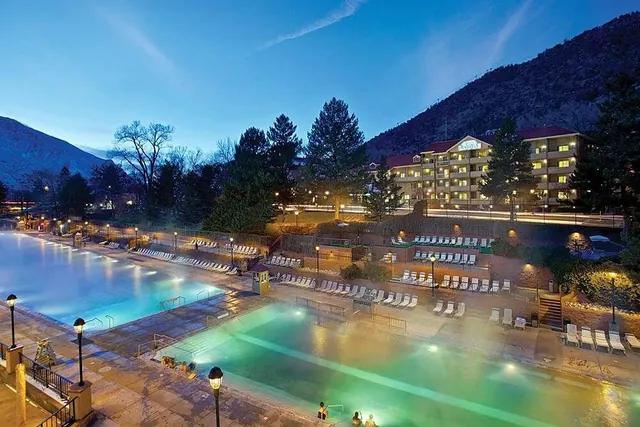 light up steaming hot spring pools at dusk at glenwood hot springs colorado
