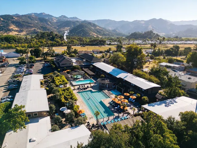 Aerial view of Calistoga Spa Hot Springs showing multiple pools and buildings with mountains in the background near Calistoga California.