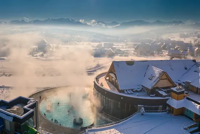 Chocholowskie Thermal Baths near Chochołów with tatra mountains in the background