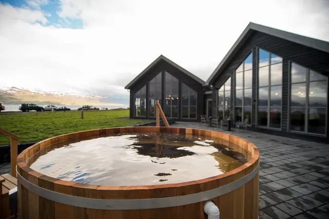 Hot tub in front of Bjorbodin Beer Spa near Dalvik, Iceland