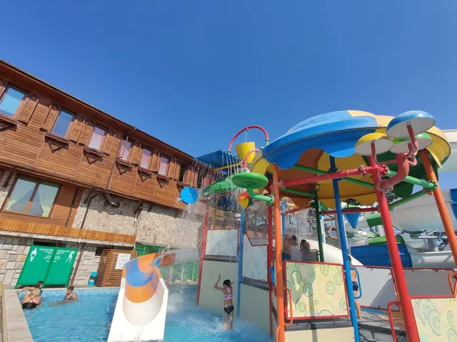 Children's splash play area with colorful water features and a small pool at Thermal Aqua Park Elbrus near Velingrad Bulgaria.
