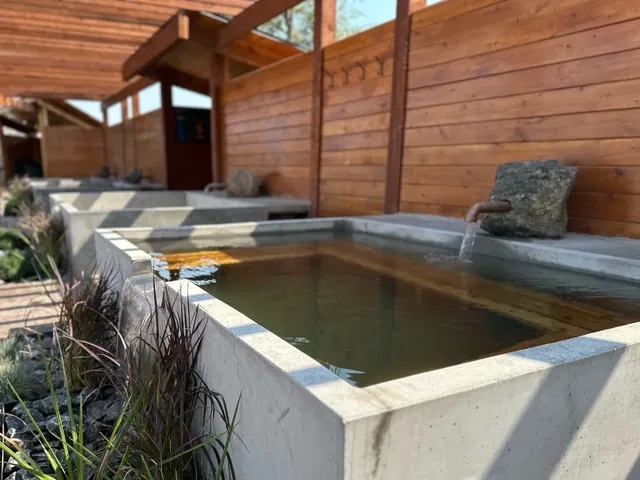Private outdoor soaking tub; check booking inclusions — Hot Lake Springs