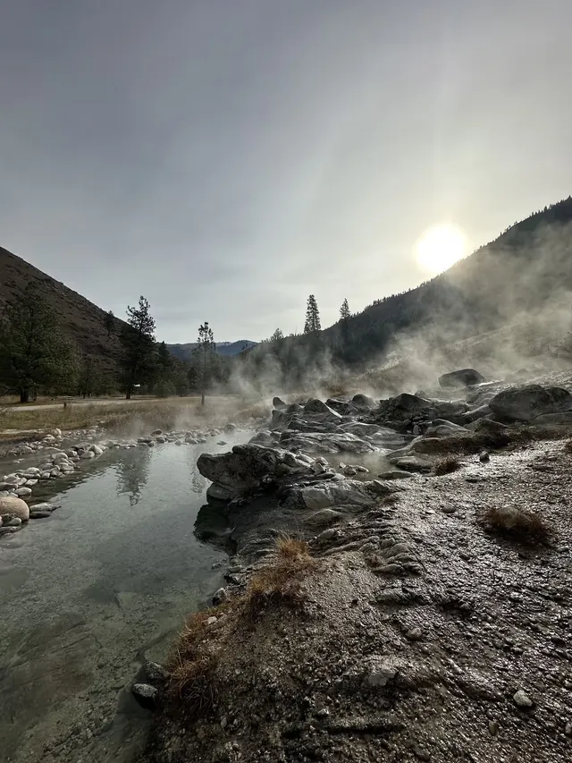 Steaming natural riverside hot spring at Mile 16 Hot Springs, Idaho.