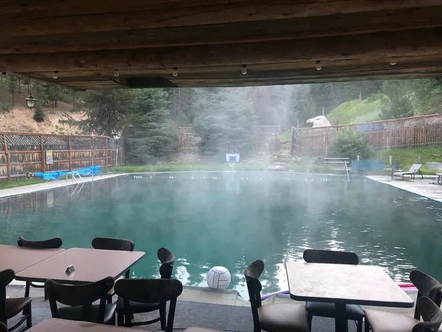 steaming hot spring pool with forest in the background at red river hot springs idaho 