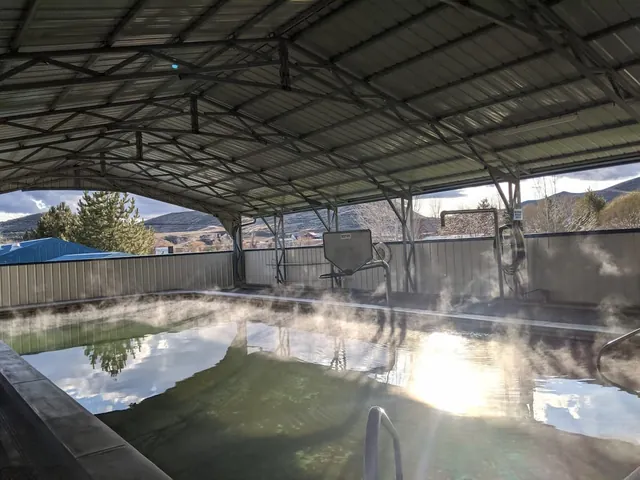 Partly covered steaming hot spring pool at roystone hot springs idaho