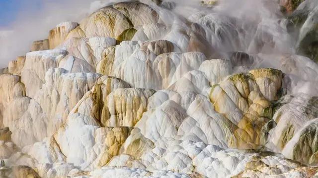 Colorful travertine terraces; bathing is prohibited — Mammoth Hot Springs