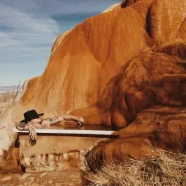 Bathing tub beneath mineral deposits — Mystic Hot Springs