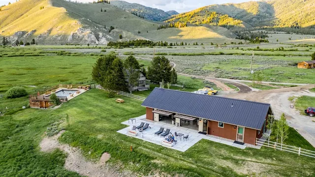 Ranch with hot spring pool in a mountain valley at idaho rocky mountain ranch