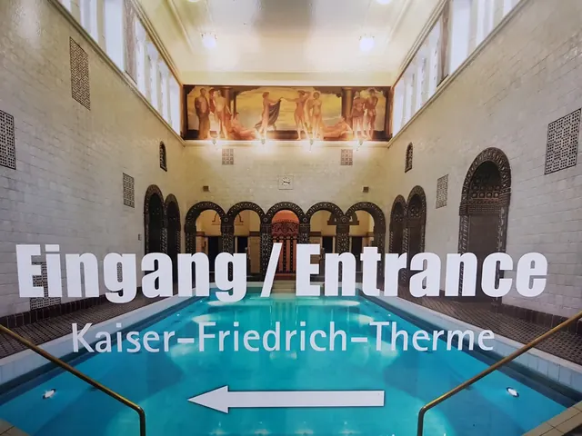 Wall detail featuring classical decorative columns and ornate ceramic insets at Kaiser-Friedrich-Therme in Wiesbaden Germany.