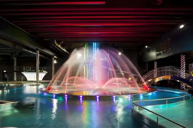 Indoor pool with neon lighted fountains at Holiday Club Saimaan Rauha Water Park & Day Spa, Finland