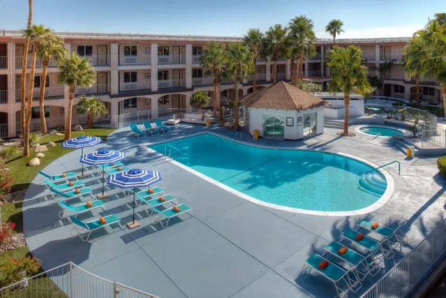 Outdoor hot spring pool with lounge chairs at aqua soleil hotel and mineral water spa california