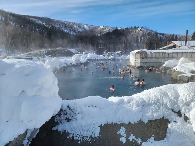 people soaking in Chena Hot Springs Alaska in winter time