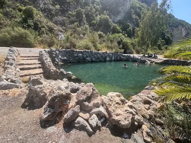 Natural hot spring pools in a semi arid canyon at koniaviti baths in greece