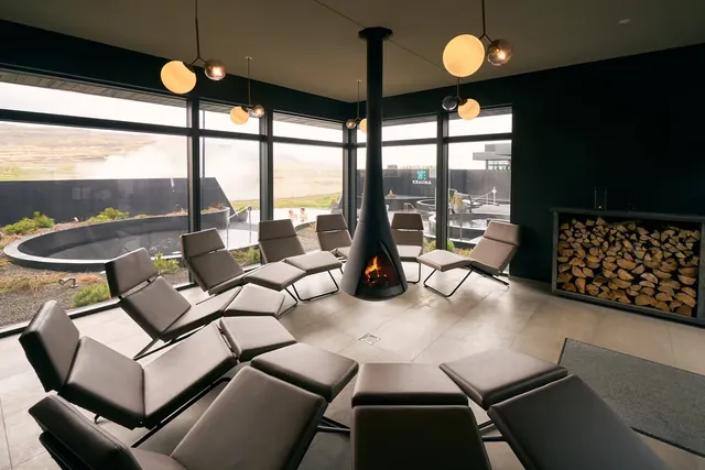 Relaxation room with a fireplace at Krauma Geothermal Baths near Reykholt, Iceland